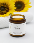 Sans Skincare Whipped Facial Scrub in amber jar with lid off, creamy natural exfoliating scrub that smooths and moisturizes skin