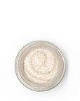 Open jar of Sans Skincare honey lip scrub – natural exfoliating texture with real honey for soft, smooth, nourished lips