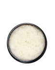 Sans Skincare Whipped Body Scrub in open amber jar, creamy natural exfoliating scrub that polishes and moisturizes skin