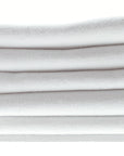 Bright white organic cotton peshtemal towel with fringe detail, soft and sustainable