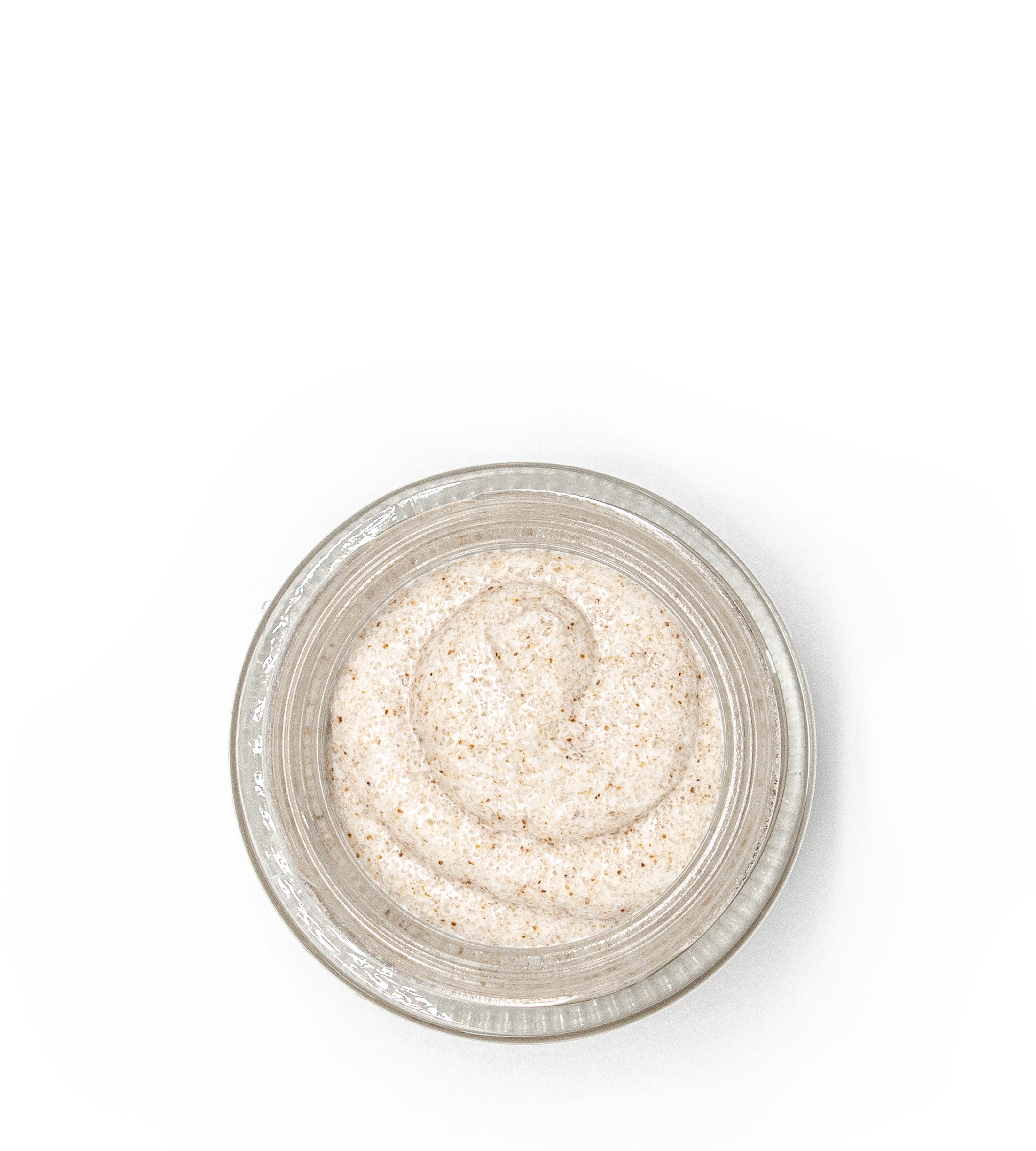 Open jar of Sans Skincare honey lip scrub – natural exfoliating texture with real honey for soft, smooth, nourished lips