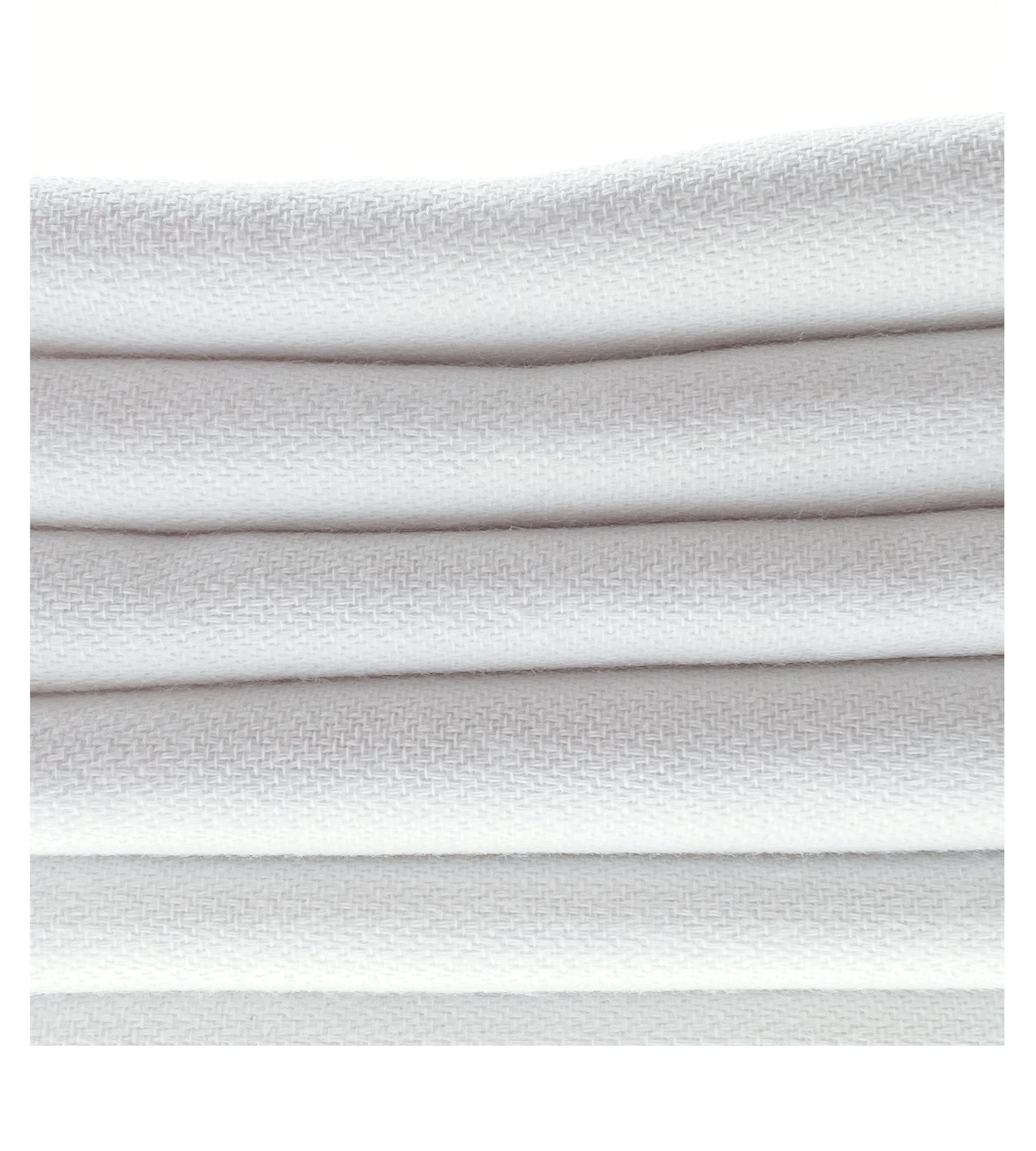 Bright white organic cotton peshtemal towel with fringe detail, soft and sustainable